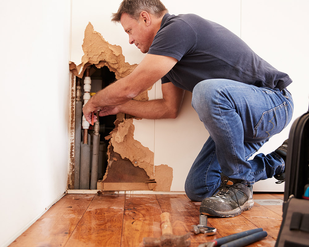 plumber-repairing-water-leaking-pies-at-house-wall-interiors-brandon-ms